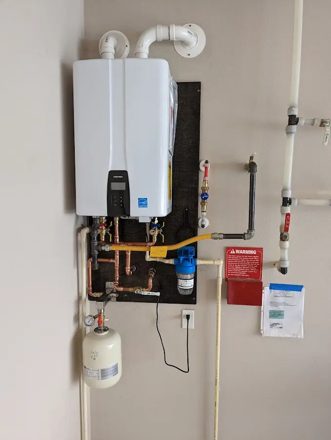 Professional plumber installing copper piping in a Rancho Cucamonga home